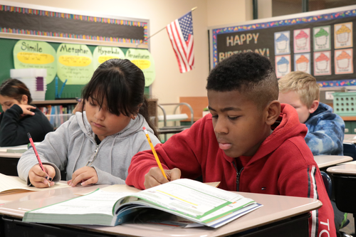 Students collaborate on an assignment
